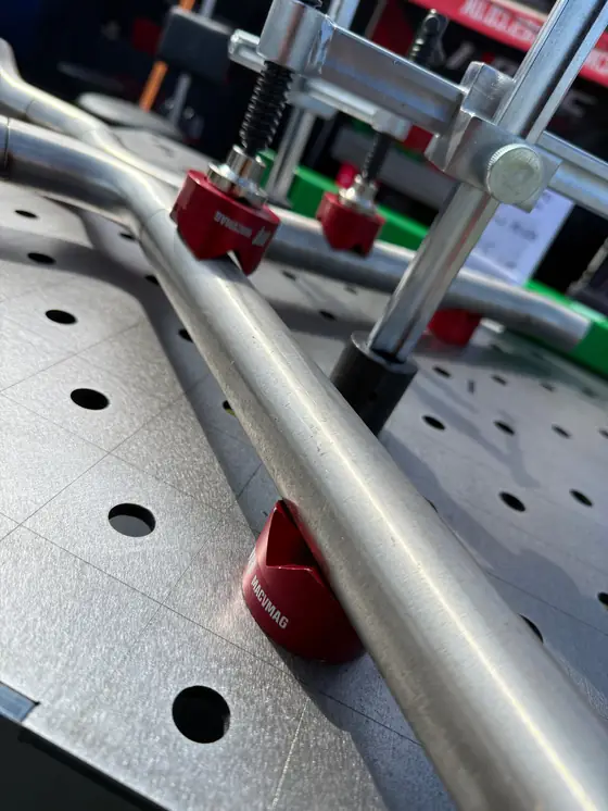 MAC clamps holding tube on a fixture table